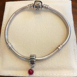 Silver Pandora dangle charm with synthetic garnet